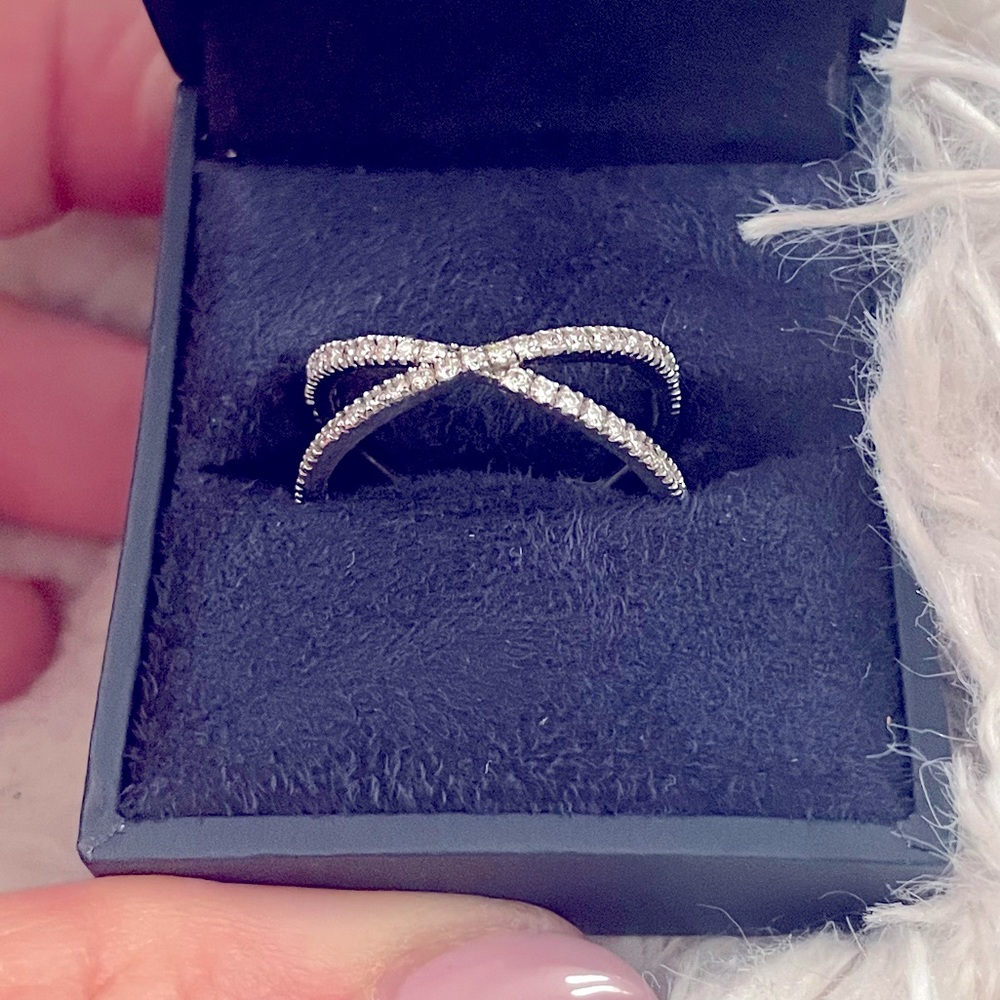 Natural diamond and 18k white gold criss cross ring. Size 7.5